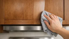 How to remove greasy buildup from kitchen cabinets without ruining the finish